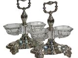 two silver plated candlesticks with glass bowls and handles