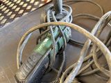 a pile of wires and tools on a table