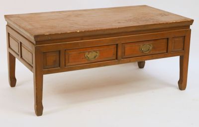 a small wooden table with two drawers on it