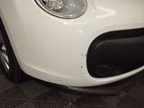 a close up of a white car with a black bumper