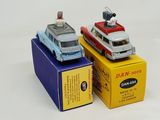 two toy cars that are on top of a box