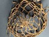 a net with a bird sitting on top of it
