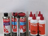 several different types of glues are lined up on a table