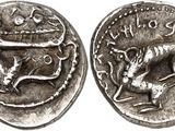 a silver coin with an image of a horse and a man on it