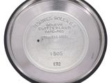 an image of a close up of a metal plate with a label on it