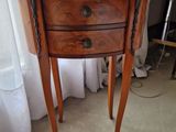 a small table with a drawer on top of it
