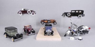 a lot of different model cars on display in a display case