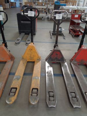 a lot of different types of pallets in a warehouse