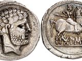 a close up of a coin with a horse on it