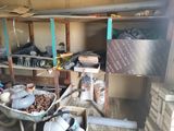 a wheelbarrow full of tools in a garage