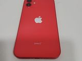 a close up of a red iphone sitting on top of a white table