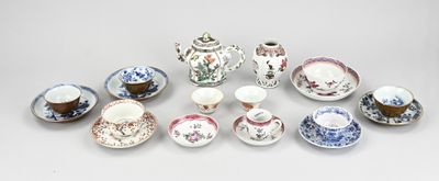 many different types of tea cups and saucers on the table