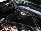 a car engine with the hood up and the hood down