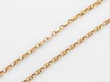 a pair of gold chains on a white background