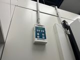 a control panel mounted on the wall of a room