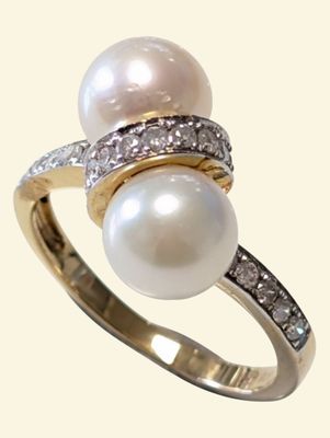 an image of a pearl and diamond ring on a white background