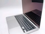 a close up of a laptop computer on a white surface