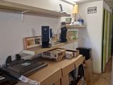 a desk with a laptop and a printer on it