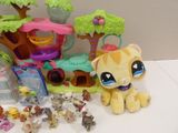 a lot of littlest pet shop toys on the table