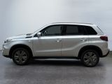 a picture of a white suv parked in a garage