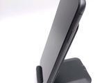a cell phone that is sitting on top of a stand