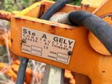a close up of a machine with a hose attached to it