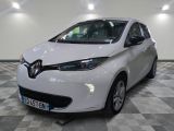 a picture of a white car in a showroom
