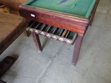 a pool table with a green cloth on top of it