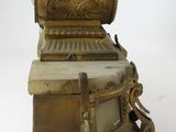 a small statue of a man sitting on top of a chair