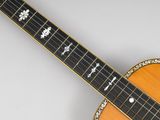 a close up of an acoustic guitar with a cross on it