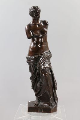 a statue of a woman holding a baby in her arms