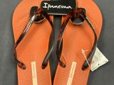 a pair of orange flip flop flop flop flop flop flop flop flop flop flop flop flop flop flop flop flop
