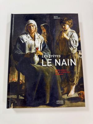 an image of a book with a painting of a woman and a man