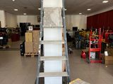 a ladder that is sitting in the middle of a room