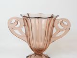 an image of a pink glass vase on a white background