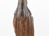 an image of a statue of a woman in a brown dress