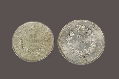 two silver coins, one of which has a crown and the other of which has a crown on it