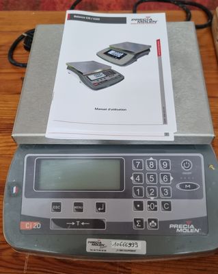 a digital scale on a table with a box on it