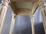 a wooden table with a shelf on top of it
