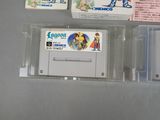 two nintendo game cartridges sitting next to each other on a table