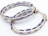 pair of silver and blue enamel hoop earrings on a white background