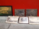 three framed pictures of a ship and a ship in a red room