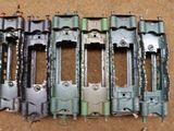 a group of metal parts that are laying out on the floor
