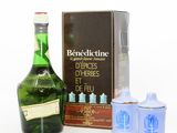 an image of a bottle of benedeutine and two blue glass containers