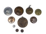 some of the medals are on display on a white surface