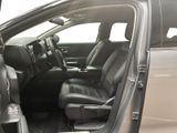 the interior of a car with the door open and the passenger seat down