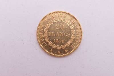 une image d'une pièce d'or sur une surface blanche