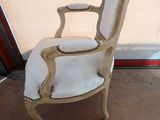 a chair that is sitting in front of a window