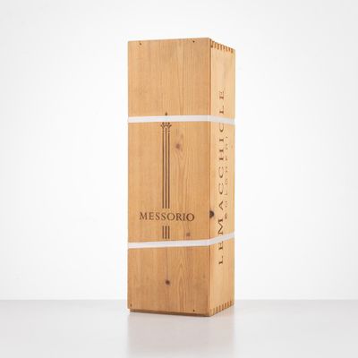 a wooden box with a knife on top of it sitting on a table