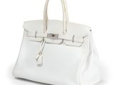 a white leather handbag on a white background